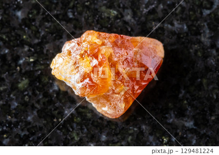 sample of unpolished scheelite mineral on black sample of unpolished scheelite mineral on black 129481224