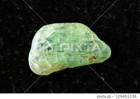 sample of tumbled green kyanite mineral on black sample of tumbled green kyanite mineral on black 129481236