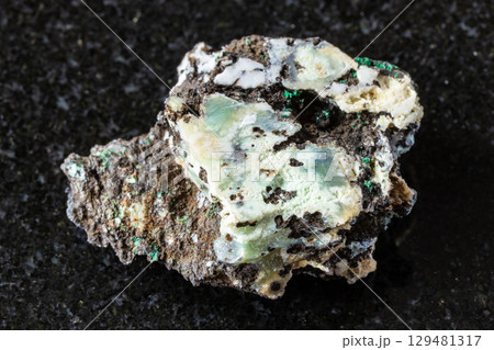 sample of rough tenorite mineral on black granite sample of rough tenorite mineral on black granite 129481317