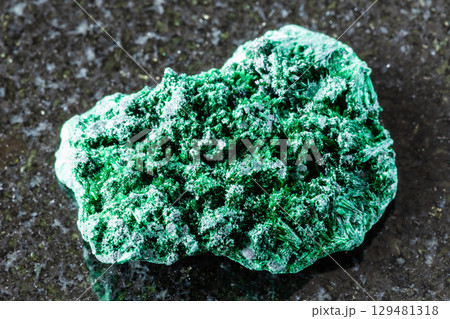 sample of rough fibrous malachite mineral on black 129481318