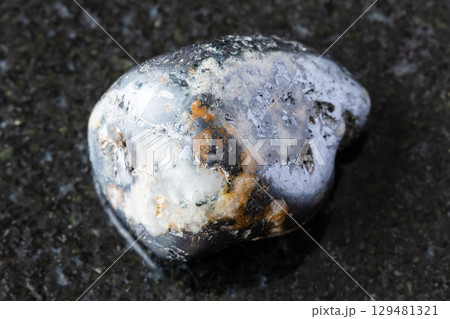 rolled cleiophane and mushketovite rock on black 129481321