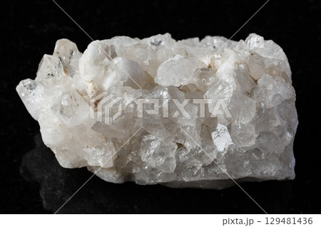 sample of rough druse of quartz rock on black sample of rough druse of quartz rock on black 129481436