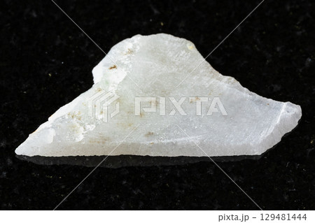 sample of rough white nephrite mineral on black sample of rough white nephrite mineral on black 129481444