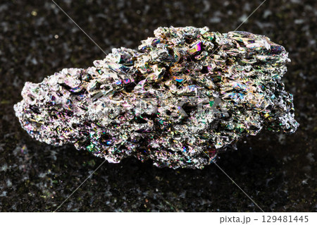 sample of raw carborundum rock on black granite sample of raw carborundum rock on black granite 129481445