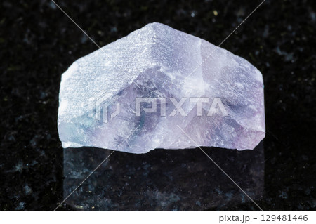 rough purple striped fluorite mineral on black rough purple striped fluorite mineral on black 129481446