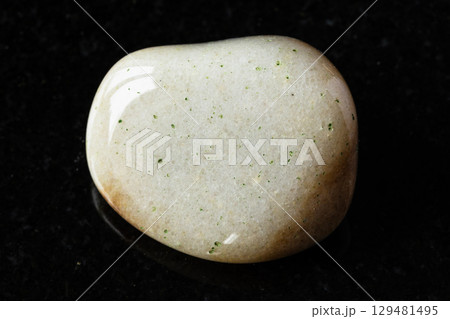 sample of polished brown quartzite rock on black 129481495