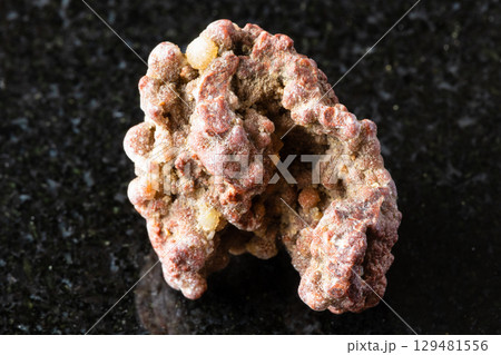 sample of raw chalcedony rock on black granite sample of raw chalcedony rock on black granite 129481556