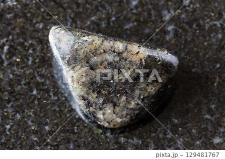 sample of polished diorite mineral on black 129481767