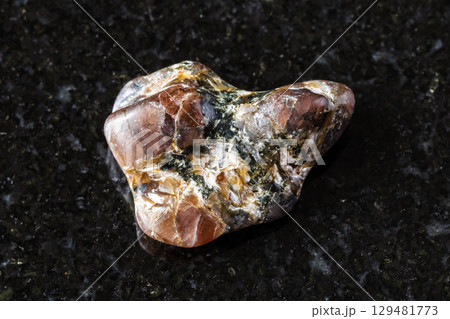 sample of polished andalusite mineral on black sample of polished andalusite mineral on black 129481773