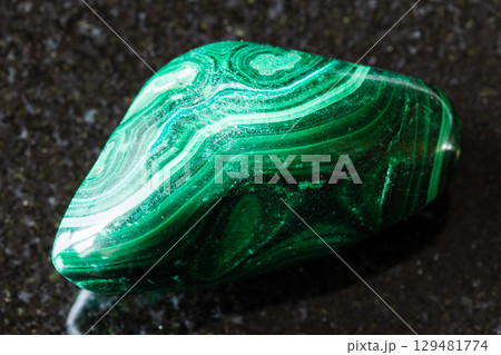 sample of polished malachite mineral on black sample of polished malachite mineral on black 129481774
