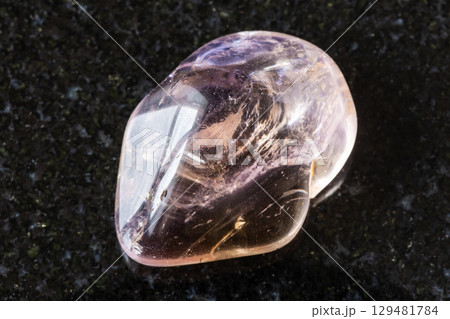 sample of polished ametrine mineral on black sample of polished ametrine mineral on black 129481784