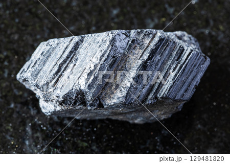 sample of raw tourmaline schorl mineral on black 129481820