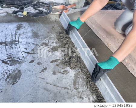 Grinding and leveling of cement floor surface Grinding and leveling of cement floor surface 129481958