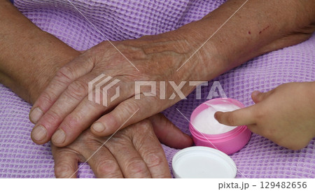 Kid finger take white moisturizer cream for skin care Kid finger take white moisturizer cream for skin care 129482656
