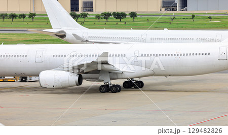 Clear picture of unpainted airliner engine and main landing gear. Clear picture of unpainted airliner engine and main landing gear. 129482826