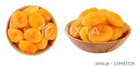 Dried apricots in wooden bowl isolated on white background with  full depth of field. Top view. Flat lay Dried apricots in wooden bowl isolated on white background with  full depth of field. Top view. Flat lay 129483326