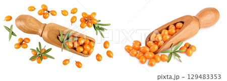 Sea buckthorn in wooden scoop. Fresh ripe berry with leaves isolated on white background. Top view. Flat lay Sea buckthorn in wooden scoop. Fresh ripe berry with leaves isolated on white background. Top view. Flat lay 129483353