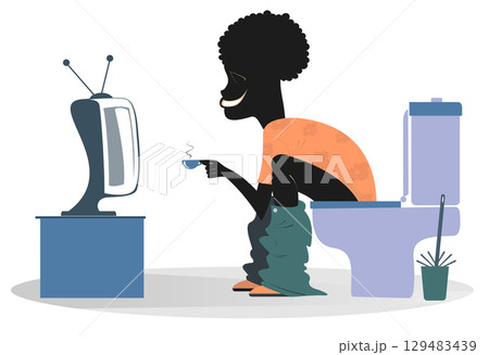 African man in toilet watching TV. Young African man sitting in the toilet with a cup of coffee or tea and watching TV 129483439