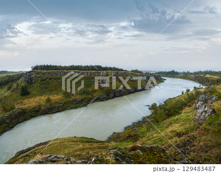 Hrutey island public park near Blonduos town, North-West of Iceland. View during auto trip by Ring Road. Spectacular Icelandic landscape with scenic autumn nature and Blanda river with cataracts. 129483487