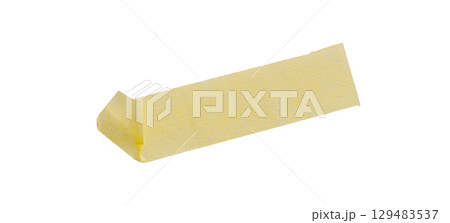 Yellow painter's tape isolated on white background, macro. Torn, crumpled, twisted strips of yellow painter's tape on white background 129483537