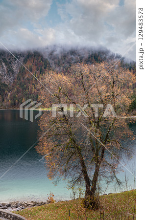 Mountain alpine autumn lake Achensee, Alps, Tirol, Austria. Mountain alpine autumn lake Achensee, Alps, Tirol, Austria. 129483578