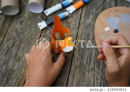 DIY and kid's creativity. Step by step instruction: how to make tiger from toilet roll tube. Step five: draw the tiger's face. 129483631