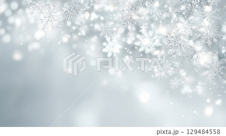 白銀の雪の結晶が舞うクリーンな背景素材 129484558