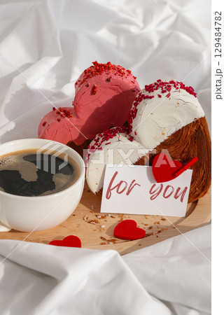 FOR YOU text message paper note card Morning breakfast Valentine's Day Birthday celebration Delicious fresh variety croissants topped with colorful flavor Ganache. Creation unique heart shape bakery 129484782