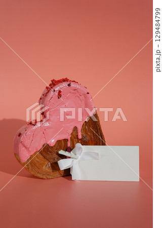 Template paper note Heart shaped strawberry berry croissant on pink background with copy space. Puff pastry new trendy sweet dessert bakery. Creamy dough 129484799