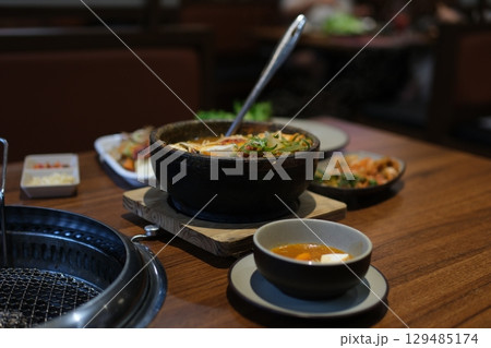 Tofu delicious soup. Hot boiling Korean spicy soft tofu stew, Sundubu jjigae Tofu delicious soup. Hot boiling Korean spicy soft tofu stew, Sundubu jjigae 129485174