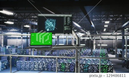 Mockup notebook in data center displaying neural network activity. Automated infrastructure green screen laptop workstation on industrial platform inside server hub showing AI machine learning scripts Mockup notebook in data center displaying neural network activity. Automated infrastructure green screen laptop workstation on industrial platform inside server hub showing AI machine learning scripts 129486811