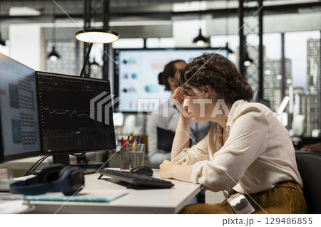 Worried finance advisor looks at forex trends market fall and losing money, dealing with a financial crisis due to stock crash price drop. Frustrated manager under pressure, bankruptcy. 129486855