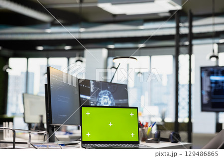 Green screen laptop on AI startup office desk displaying artificial intelligence programming languages code. Chroma key notebook used for AI machine learning testing and quality assurance 129486865