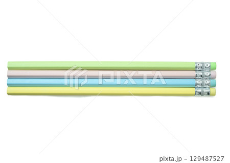 Row of unsharpened colorful wooden pencils isolated over a white background. Concept of stationery Row of unsharpened colorful wooden pencils isolated over a white background. Concept of stationery 129487527