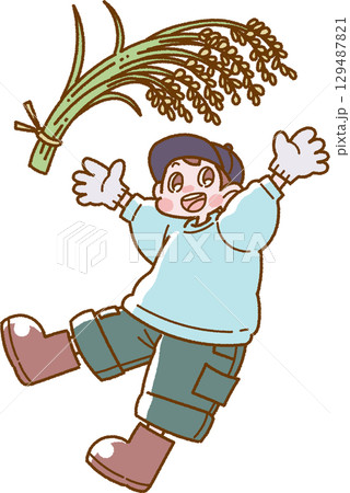 収穫した稲を掲げた笑顔の男の子のイラスト 129487821