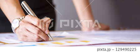 Banner Businesswoman hands note meeting document in conference room. Woman Hands writing planning on notebook. Female hand holding pencil write on diary sketchbook. Business Planning with copy space Banner Businesswoman hands note meeting document in conference room. Woman Hands writing planning on notebook. Female hand holding pencil write on diary sketchbook. Business Planning with copy space 129490225