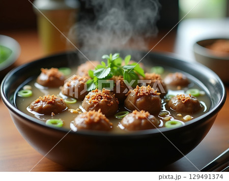 Delicious and Steaming Meatball Soup Asian Dish in Bowl Food Photography 129491374