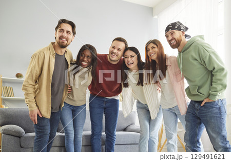 Happy Friends Embracing At Home Party Happy Friends Embracing At Home Party 129491621