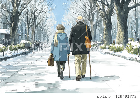 冬の公園で杖を使いながら屋外散歩を楽しむ高齢夫婦、優しい雪景色、活動的で健康的 129492775