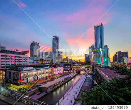 Skyscraper and Pratunam pier in Bangkok; water transportation by speed boat is one of the alternative choice for solving the traffic congestion problem in Bangkok. 129493999