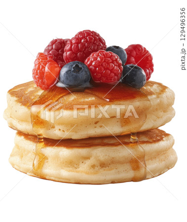 Fluffy pancakes with syrup and fresh berries on top, including raspberries and blueberries Fluffy pancakes with syrup and fresh berries on top, including raspberries and blueberries 129496356