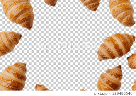 Golden croissants arranged in circular pattern on transparency background 129496540