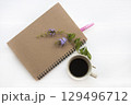 notebook planner with hot coffee arrangement flat lay style  129496712