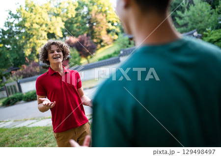 Friends spending time together in the park and looking joyful 129498497