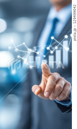 Stock market graph with hand pointing at rising bar chart and glowing data points showing financial growth and analysis in business environment 129499042