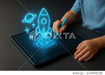 Digital learning in smart classroom uses educational technology to inspire creativity as child draws glowing rocket and planet on tablet with stylus pen 129499189