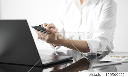 Business concept. A confident gesture by a female leader with leadership and innovative attitude. Business concept. A confident gesture by a female leader with leadership and innovative attitude. 129500421