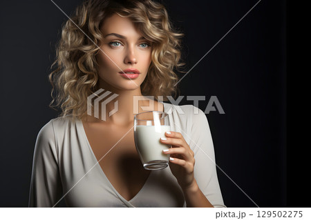 beautiful young woman with a glass of milk in her hands. healthy and healthy drinks beautiful young woman with a glass of milk in her hands. healthy and healthy drinks 129502275