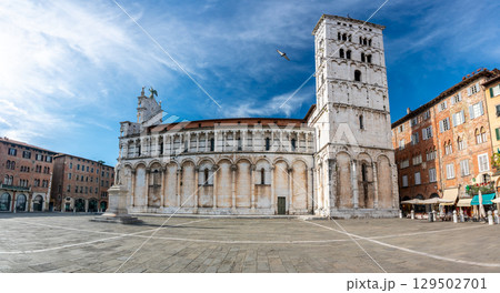 Panoramic view of Chiesa di San Michele in Foro in the historic center of Lucca Italy on a sunny summer day with clear blue sky and warm light on the ancient architecture Panoramic view of Chiesa di San Michele in Foro in the historic center of Lucca Italy on a sunny summer day with clear blue sky and warm light on the ancient architecture 129502701