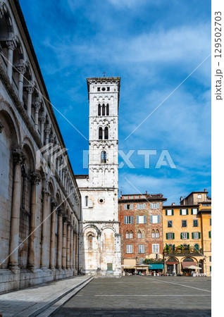 Panoramic view of Chiesa di San Michele in Foro in the historic center of Lucca Italy on a sunny summer day with clear blue sky and warm light on the ancient architecture Panoramic view of Chiesa di San Michele in Foro in the historic center of Lucca Italy on a sunny summer day with clear blue sky and warm light on the ancient architecture 129502703